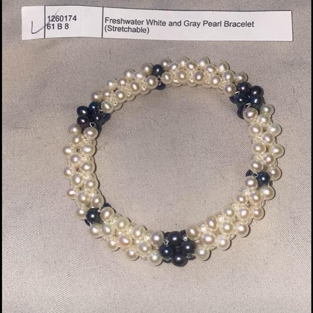 White & grey pearl bracelet.